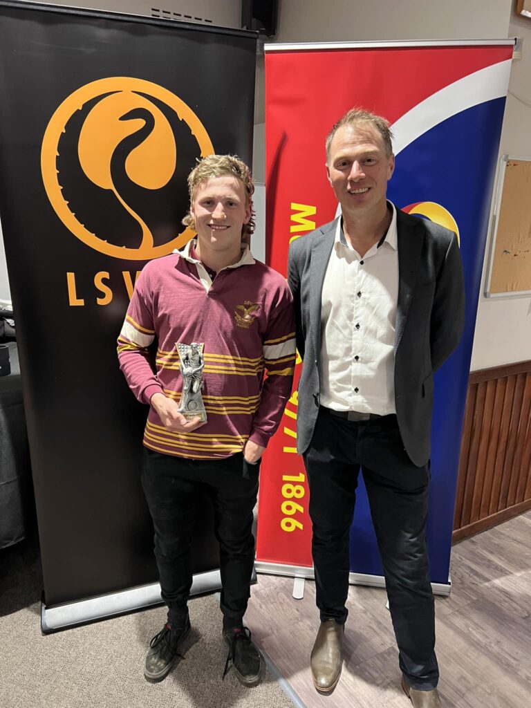 Nicholas Gleeson of Deanmill Football Club receives the 2024 Under 21 Best & Fairest award at the Lower South West Football League presentation.